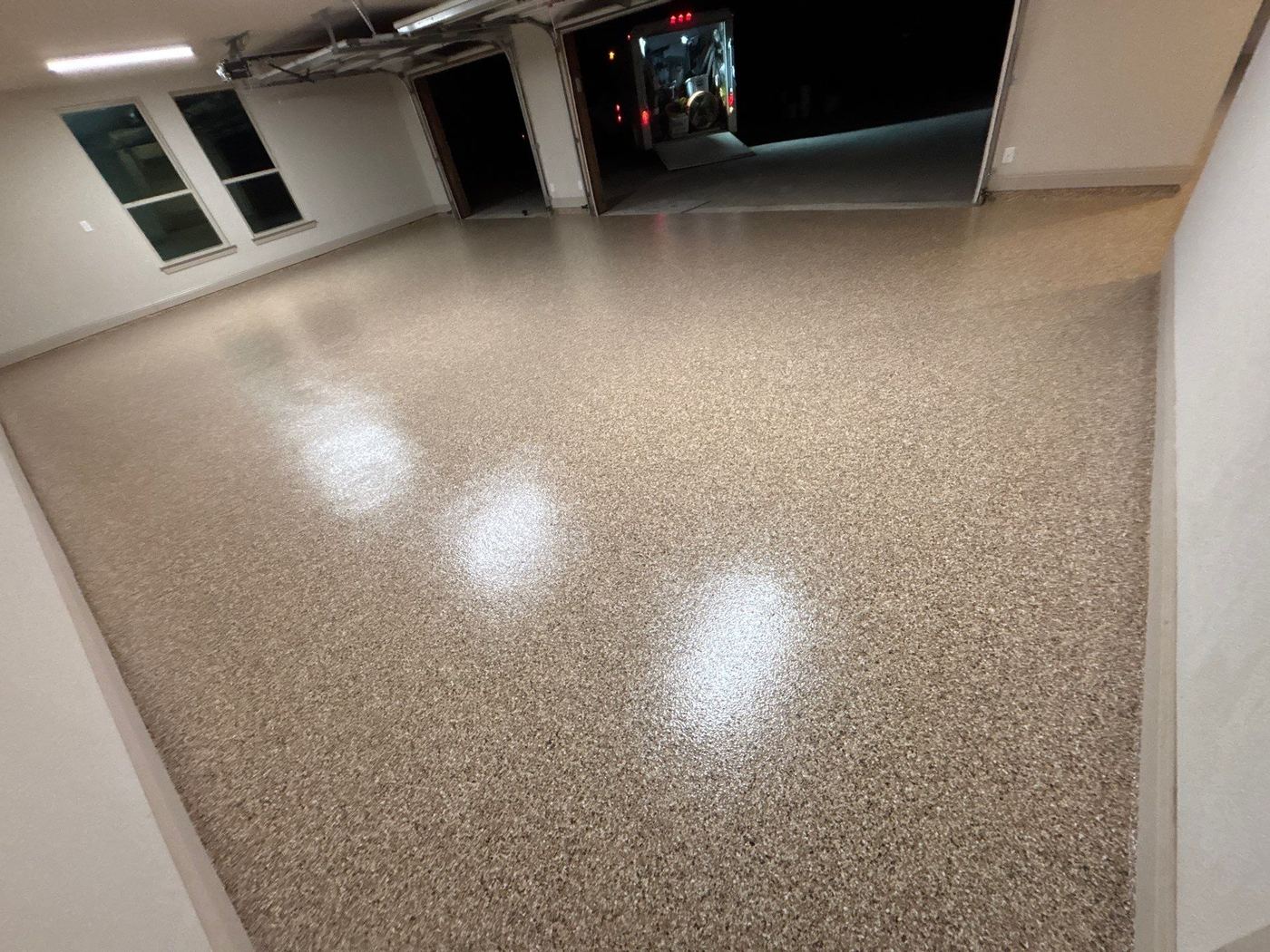 3-car garage coated with Penntek polyurea warm tan color flake — StraightLineCoatings